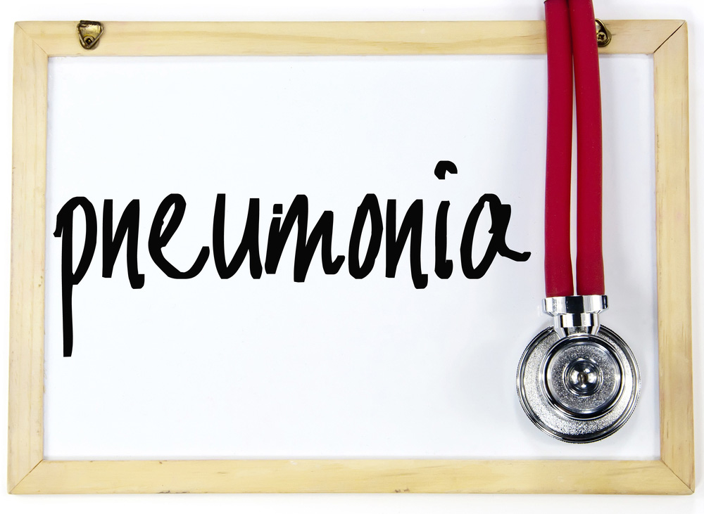 White board with "pneumonia" written on it and stethoscope