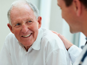 Elderly man speaking to his doctor