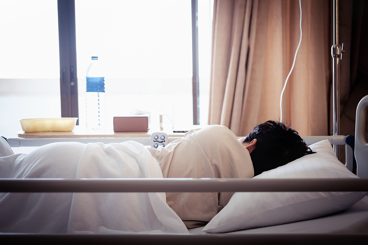 Patient sleeping in hospital bed