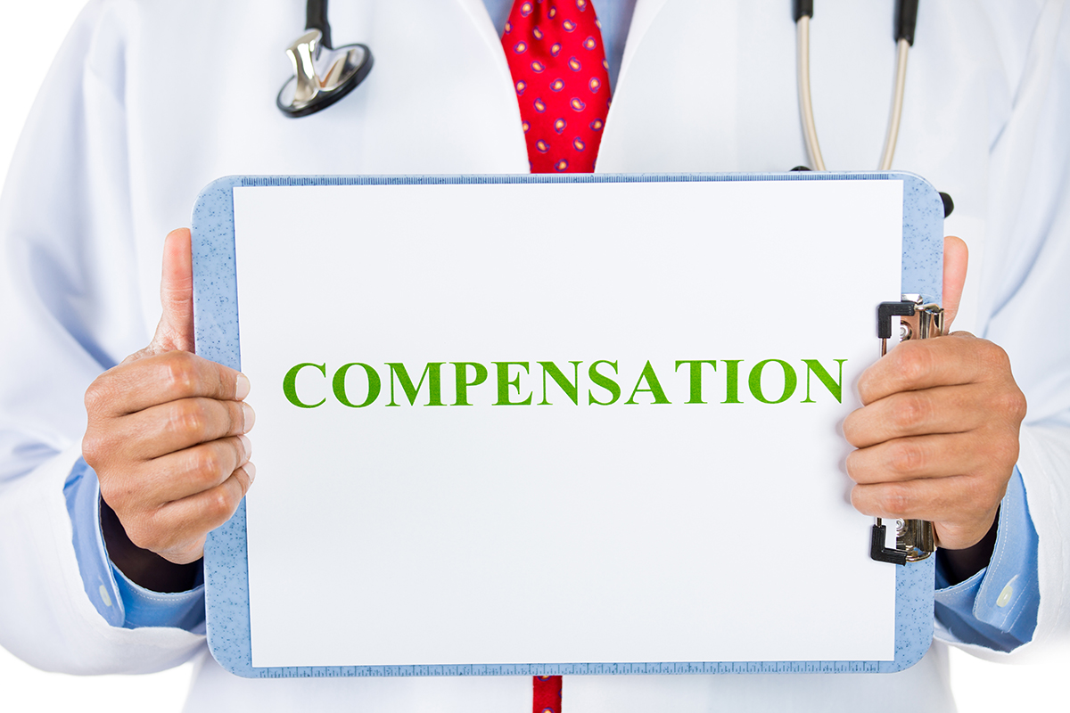 Doctor holding clipboard that says compensation