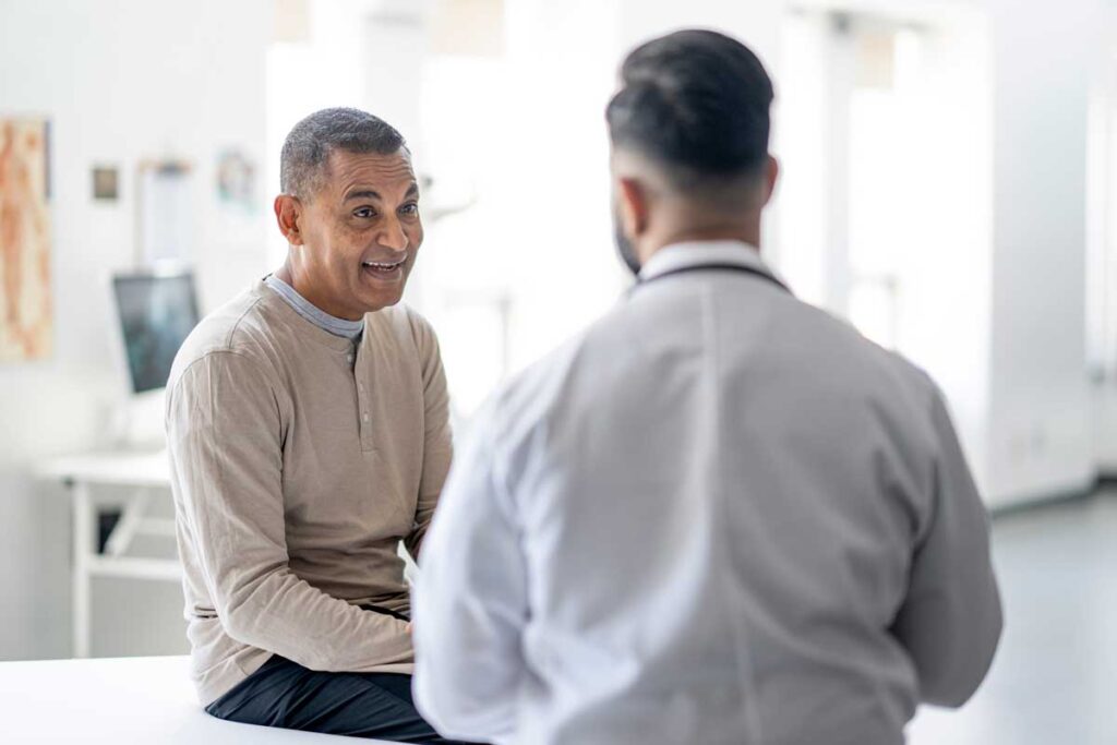 male patient talking with doctor