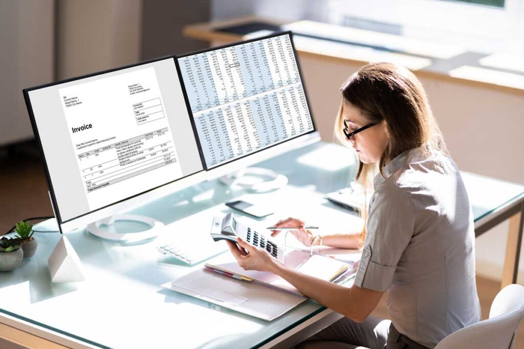 Woman looking at spreadsheets and financial data